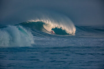 Wall Mural - male surfer on big hawaiian wave
