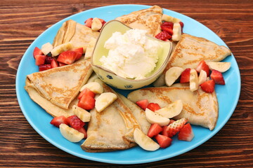 Wall Mural - Delicious pancake with sliced of strawberry and banana