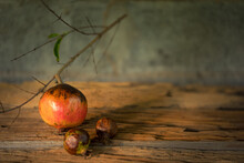 Pomegranate Fruit On Old Wooden Vintage Background