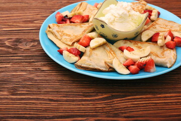 Wall Mural - Delicious pancake with sliced of strawberry and banana