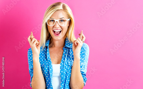 Young woman wishing for good luck Tableau sur Toile
