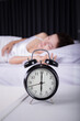 © geargodz - clock show 6 O'clock and woman sleeping on bed