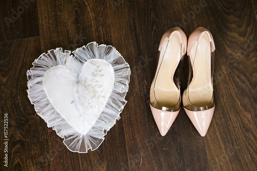 Beige Wedding Bridal Shoes And Gold Wedding Rings On White