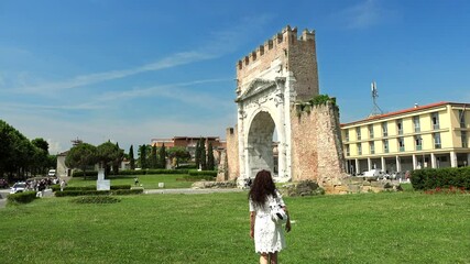 Poster - mature woman going to Arch in Rimini