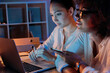 © LIGHTFIELD STUDIOS - young multiethnic businesswomen working on laptop while sitting at home office