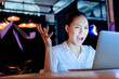 © LIGHTFIELD STUDIOS - emotional asian businesswoman yelling while looking at laptop with gesture