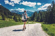 Leinwandbild Motiv Rear view of woman hiking on a mountain trek