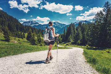 rear view of woman hiking on a mountain trek