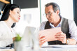 © Yakobchuk Olena - Confident employees are communicating at office