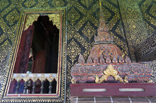 Fully Thai-style Decorated Window And Gilded Wall, With Scripture Box On Carved Wooden Shelf Inside Ho Trai Or The Library Of Tripitaka (Pali Canon) At Wat Mahathat Temple In Yasothon, Thailand