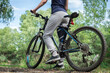 © Алексей Еремеев - Relax on a mountain bike ride along the forest path. Sports and the concept of active life in the summer. Horizontal frame