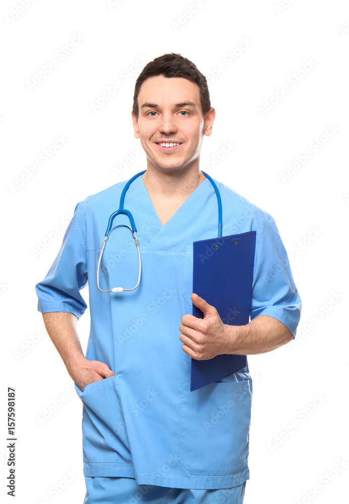 Handsome young medical assistant with clipboard on white background