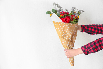 Sticker - Human hands holding beautiful bouquet with peonies on white background