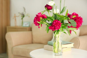 Wall Mural - Beautiful peonies and eustoma flowers in vase on light table