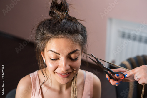 A Hair Stylist Cuts Zizi Cornrows From Young And Beautiful Girl