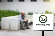 Smoking Area Sign At A Park.