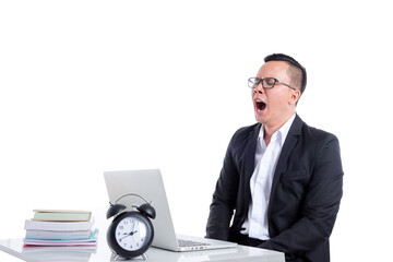 Wall Mural - Young asian businessman yawning between working