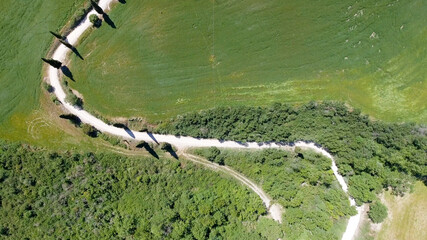 Wall Mural - Amazing aerial view of Tuscany countryside winding road in spring season - Italy