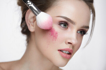 Wall Mural - beauty face cosmetics. sexy female applying makeup, loose blush