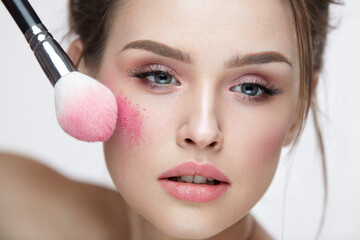Wall Mural - beauty face cosmetics. sexy female applying makeup, loose blush