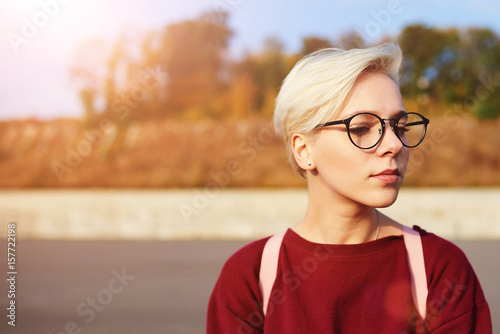 Stylish Female Hipster With Short Haircut And Trendy Eyewear