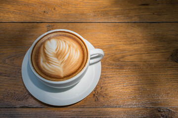 Wall Mural - white coffee cup on wood table, coffee time