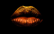 Golden Brown Lipstick On Lips Isolated On Black Background. Sexy Lips, Female Mouth. Imprint Lips. Luxury Cosmetics For Girls And Women. Beautiful Female Lips. Female Beauty Concept Girl