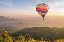 Colorful Hot Air Balloon Over The Mountain At Sunset