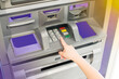 © v74 - Hand of kid using ATM