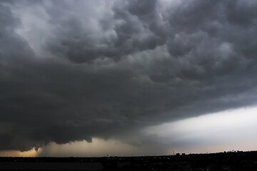 Wall Mural - dramatic view of heavy storm cloud and dark sky background.