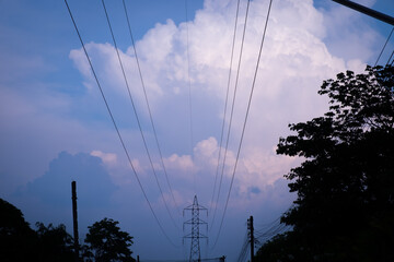 Silhouette of high voltage pole and sunset