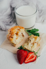 Muffin with milk and strawberries