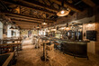© poplasen - Modern caffe interior with long bar