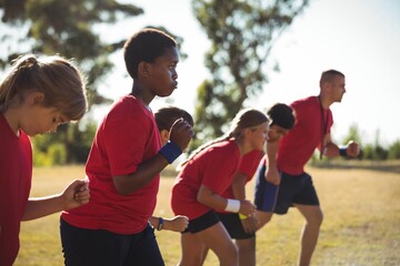 trainer training kids in the boot camp