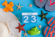 June 23rd. Image Of June 23 Calendar On Blue Background With Summer Beach, Traveler Outfit And Accessories. Summer Day