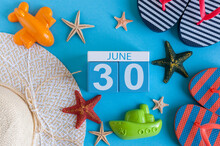 June 30th. Image Of June 30 Calendar On Blue Background With Summer Beach, Traveler Outfit And Accessories. Summer Time