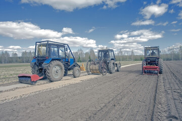 farm tractor plowing in the field