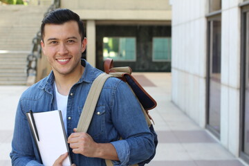 Mixed ethnicity student smiling on campus with copy space 