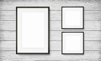 Set of black frames on wooden background