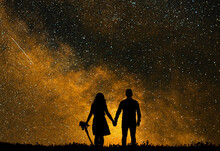The Silhouette Of Lovers Against The Backdrop Of Bright Golden Star. Love Watching The Sky.