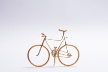 Golden Wire Bicycle Handmade On White Background