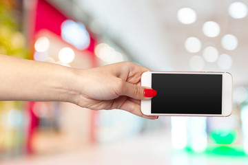 Mock up smartphone with blank screen in woman hands