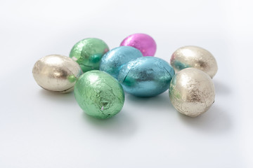  Multi-colored easter chocolate eggs in colored foil
