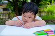 © Satori Studio - Little child drawing on the paper