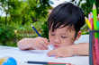 © Satori Studio - Little child drawing on the paper