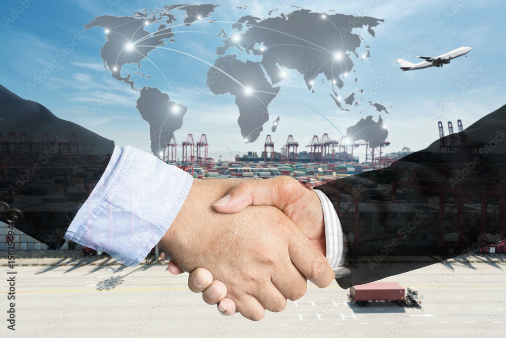 Double Exposure of a businessman handshake with Map global partner ...
