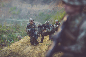 Army soldier during the military operation in the city. war, army, technology and people concept.