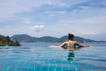 Lady relax in the pool 