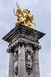 Sculpture on Alexandre III bridge. The bridge, with its exuberant Art Nouveau lamps, cherubs, nymphs and winged horses at either end, was built between 1896 and 1900. Paris, France.