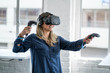 Young woman wearing a virtual reality headset.